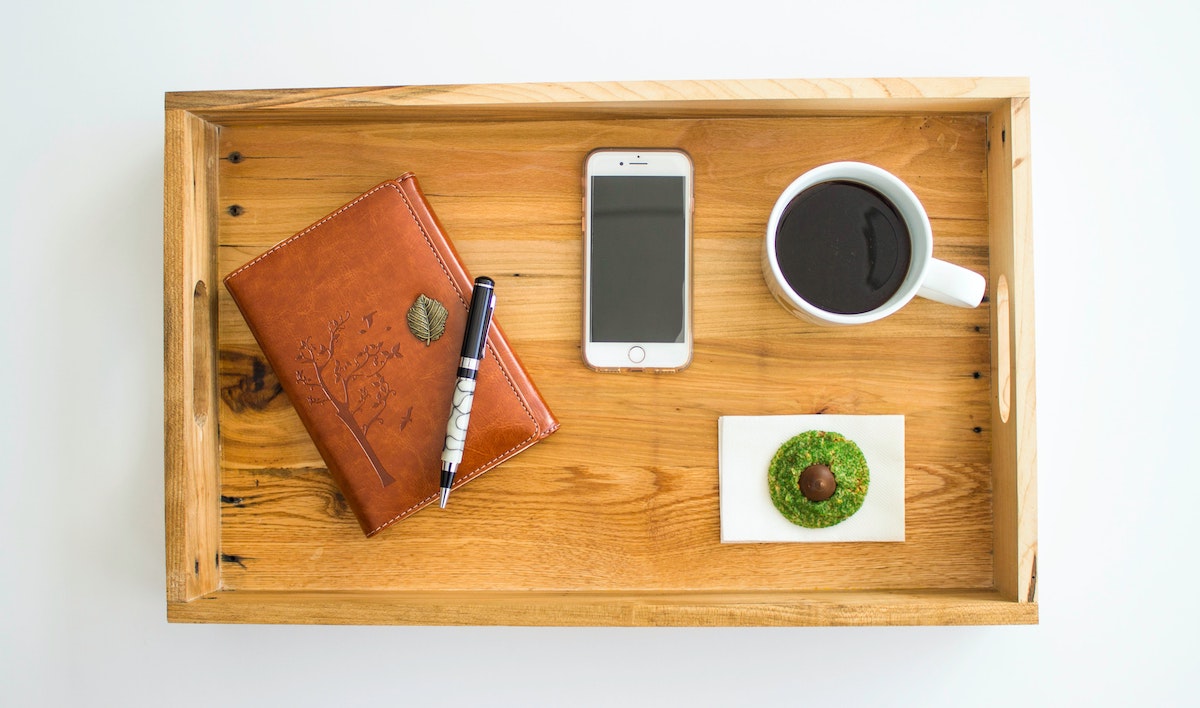 Picture of coffee and journal to illustrate how a content marketing agency can help with wordiness and organization
